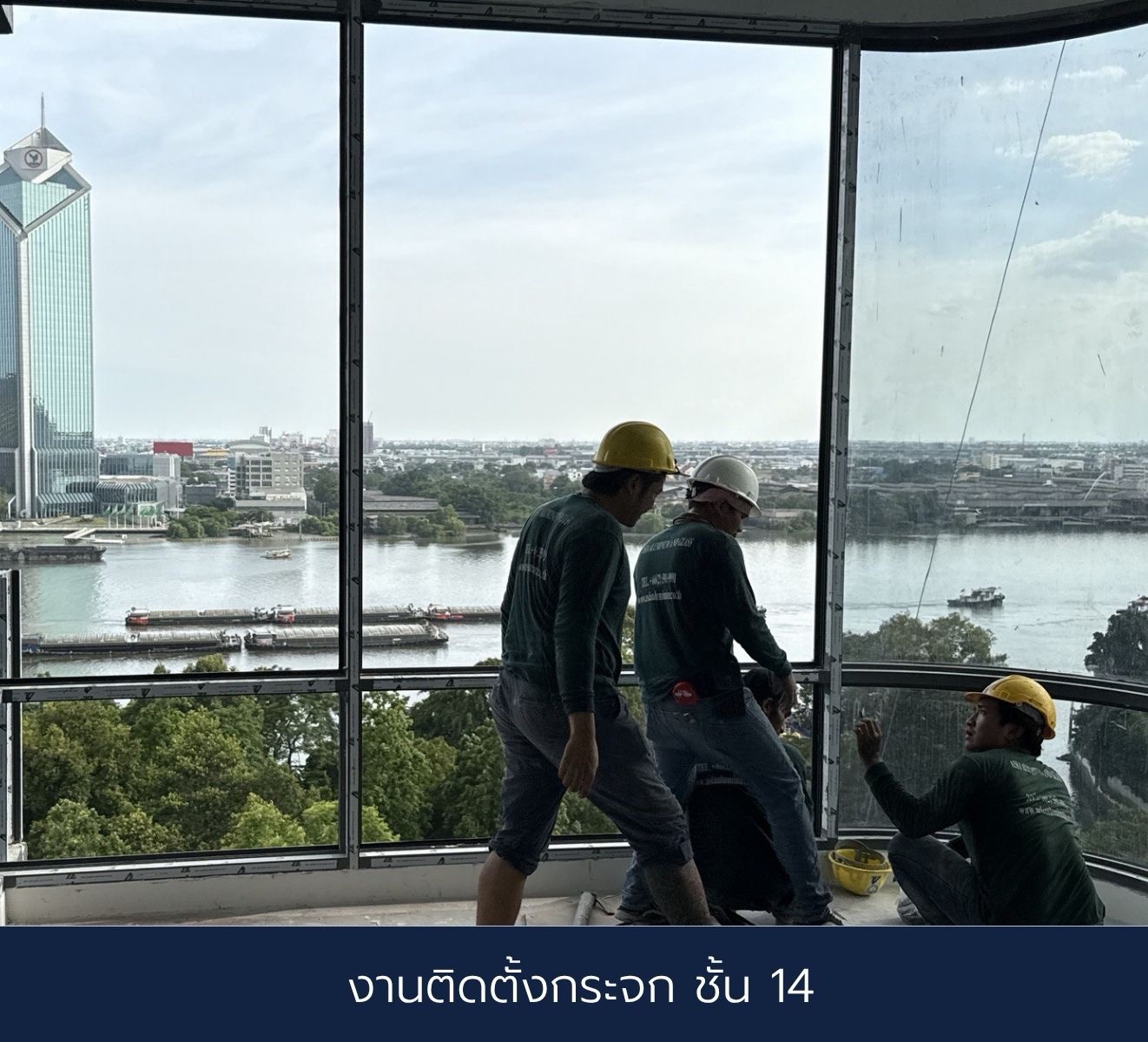 Official One River Rama 3 construction progress photograph captioned glass installation on Floor 14, looking over park canopy and the Chao Phraya River